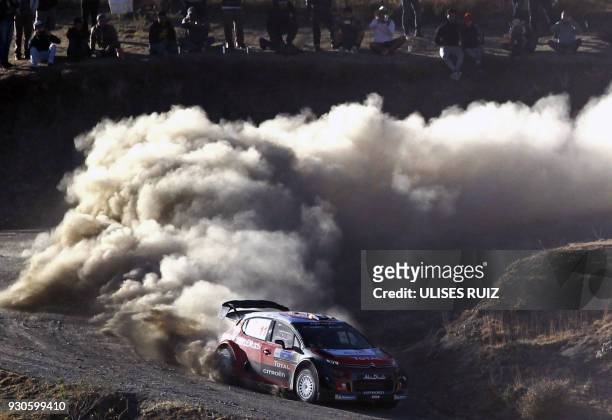 French Sebastien Loeb and co-driver monegasque Daniel Elena steer their Citroen C3 during the final day of the 2018 FIA World Rally Championship in...
