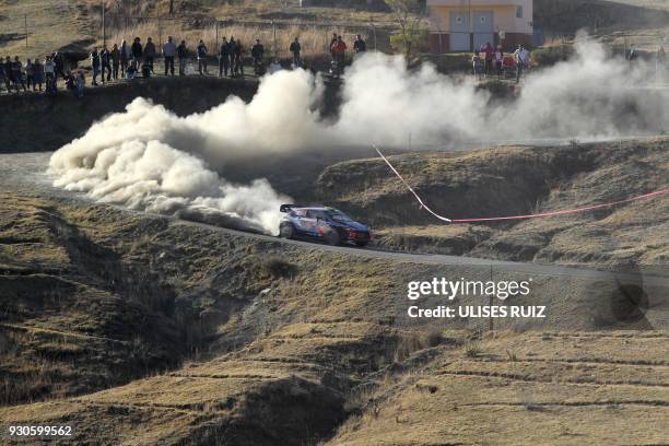 Norwegian Andreas Mikkelsen and co-driver Anders Jaeger-Synnevaag steer their Hyundai i20 Coupe WRC during the final day of the 2018 FIA World Rally...