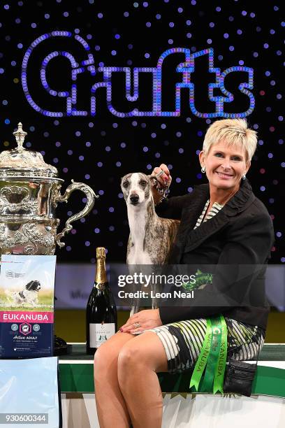 Owner Yvette Short smiles as Tease the Whippet wins Best In Show on day four of the Cruft's dog show at the NEC Arena on March 11, 2018 in...
