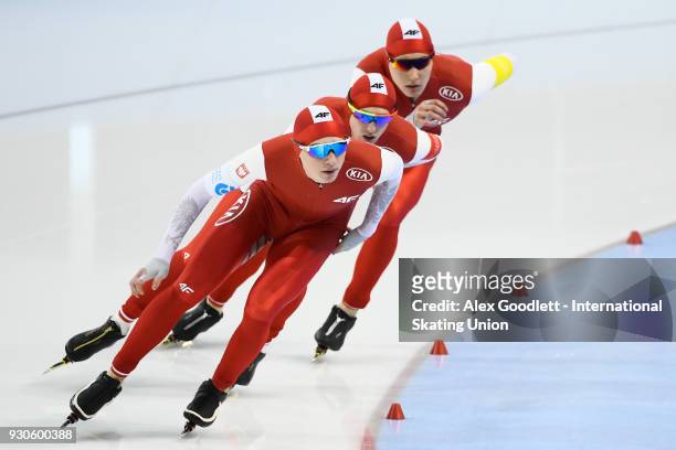 Jakub Piotrowski, Damian Zurek and Jan Swiatek of Poland perform in the men's team pursuit during the World Junior Speed Skating Championships at the...