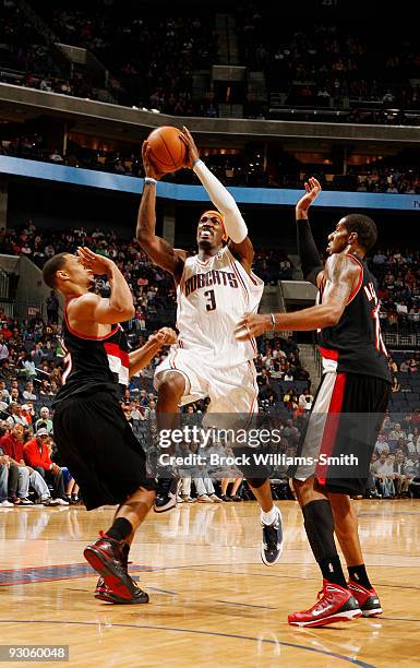 Gerald Wallace of the Charlotte Bobcats shoots a long jump shot against LaMarcus Aldridge of the Portland Trail Blazers on November 14, 2009 at the...