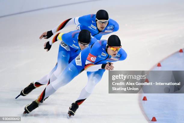 Paul Galczinsky, Max Reder and Lukas Mann of Germany perform in the men's team pursuit during the World Junior Speed Skating Championships at the...