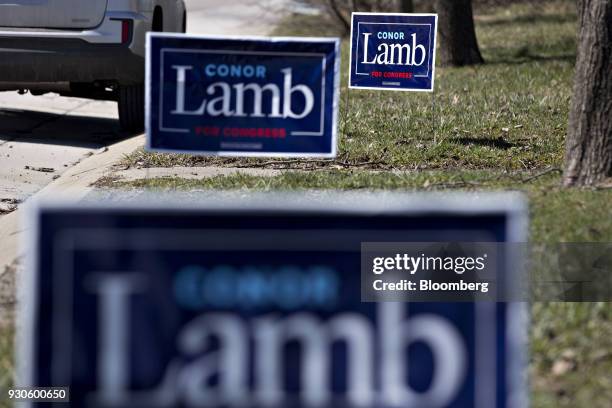 Campaign signs for Conor Lamb, Democratic candidate for the U.S. House of Representatives, stand before a campaign rally with members of the United...