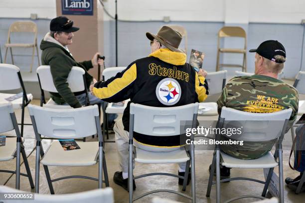 An attendee wears a Pittsburgh Steelers branded jacket before a campaign rally for Conor Lamb, Democratic candidate for the U.S. House of...