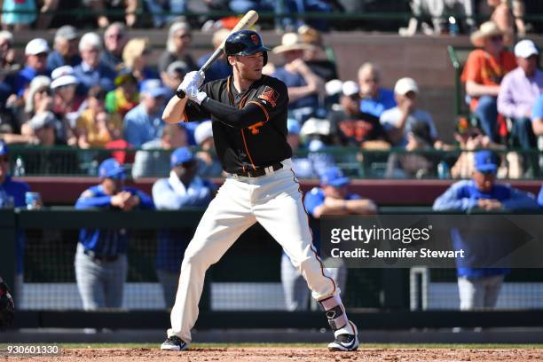 Josh Rutledge of the San Francisco Giants bats in the spring training game against the Kansas City Royals at Scottsdale Stadium on February 26, 2018...
