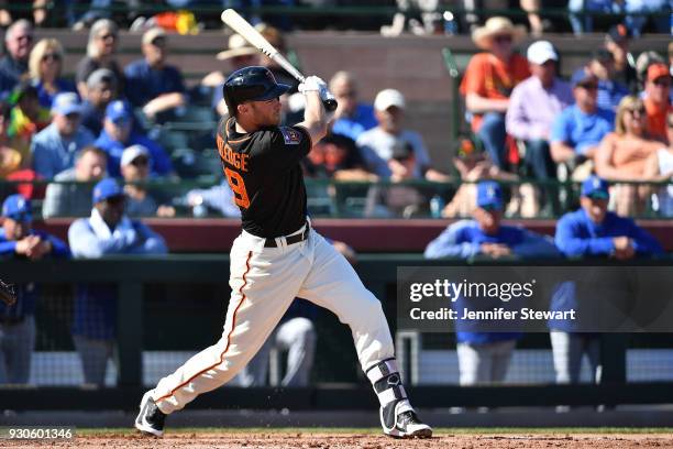 Josh Rutledge of the San Francisco Giants swings at a pitch in the spring training game against the Kansas City Royals at Scottsdale Stadium on...