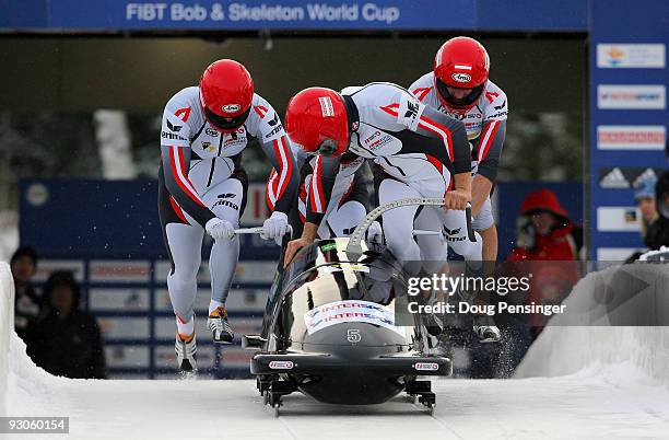 Driver Wolfgang Stampfer of Austria and his team of Juergen Mayer, Gerhard Koehler and Martin Lachkovics push from the start of their first run as...