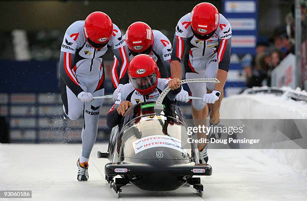 Driver Wolfgang Stampfer of Austria and his team of Juergen Mayer, Gerhard Koehler and Martin Lachkovics push from the start of their first run as...