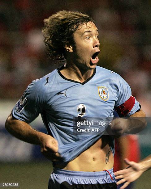 Uruguay's Diego Lugano celebrates after scoring against Costa Rica during their FIFA WC2010 qualifier football match at the Ricardo Saprissa stadium...