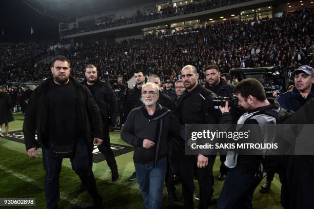 S Greek-Russian president Ivan Savvidis reacts by the pitch, after the referee refused to allow PAOK a last minute goal on March 11, 2018 during the...