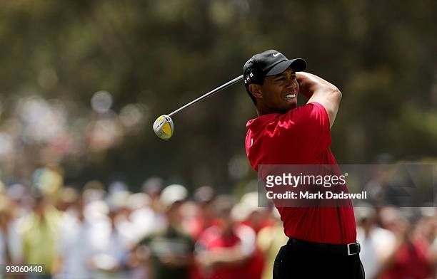 Tiger Woods of the USA plays an approach shot on the 1st hole during the final round of the 2009 Australian Masters at Kingston Heath Golf Club on...