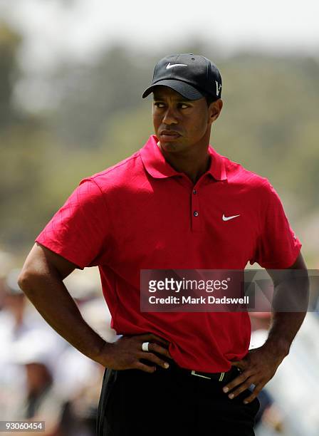 Tiger Woods of the USA prepares to play an approach shot on the 1st hole during the final round of the 2009 Australian Masters at Kingston Heath Golf...