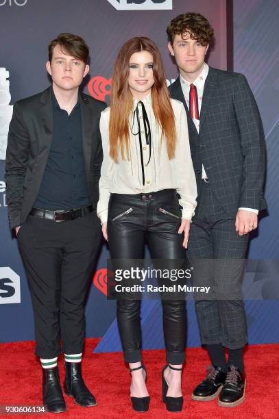 Graham Sierota, Sydney Sierota and Noah Sierota of Echosmith arrive at the 2018 iHeartRadio Music Awards which broadcasted live on TBS, TNT, and...