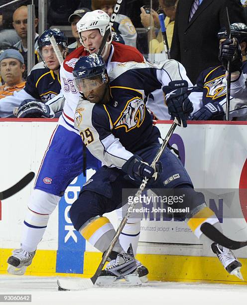 Joel Ward of the Nashville Predators battles against Ryan White of the Montreal Canadiens on November 14, 2009 at the Sommet Center in Nashville,...