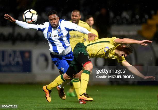 Porto's Portuguese forward Hernani vies with Pacos de Ferreira's Portuguese defender Filipe Ferreira during the Portuguese league football match...