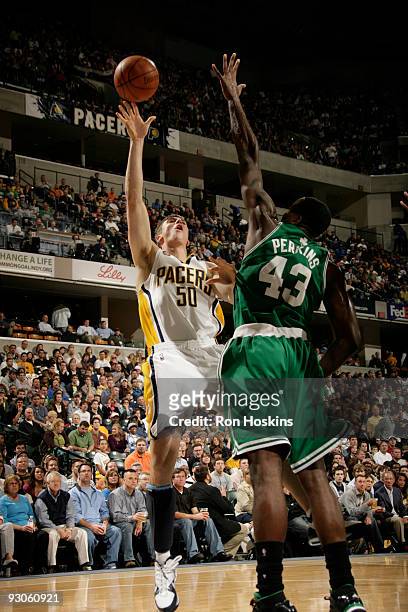 Tyler Hansbrough of the Indiana Pacers shoots over Kendrick Perkins of the Boston Celtics at Conseco Fieldhouse on November 14, 2009 in Indianapolis,...