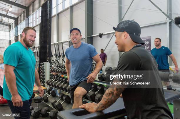 Shot put World Cup winner Tom Walsh, Ben Smith and Aaron Smith share a laugh during a New Zealand All Blacks gym session at the Apollo Projects...