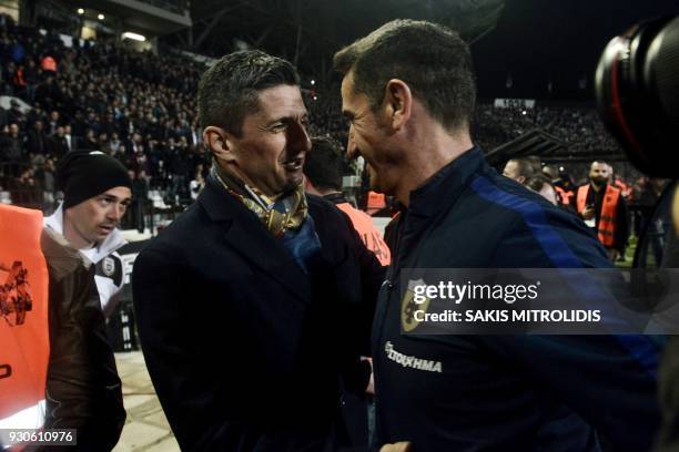 S Romanian head coach Razvan Lucescu and AEK's Spanish coach Manolo Jimenez talk within the Greek Superleague football match PAOK Thessaloniki vs AEK...