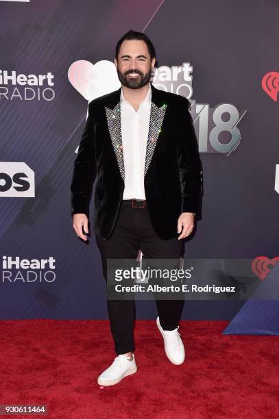 Chairman and Chief Creative Officer of iHeartLatino Enrique Santos arrives at the 2018 iHeartRadio Music Awards which broadcasted live on TBS, TNT,...