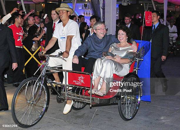 Australia's Prime Minister Kevin Rudd and his wife Therese Rein laugh as they are driven on trishaw to the APEC Leaders Dinner on November 14, 2009...