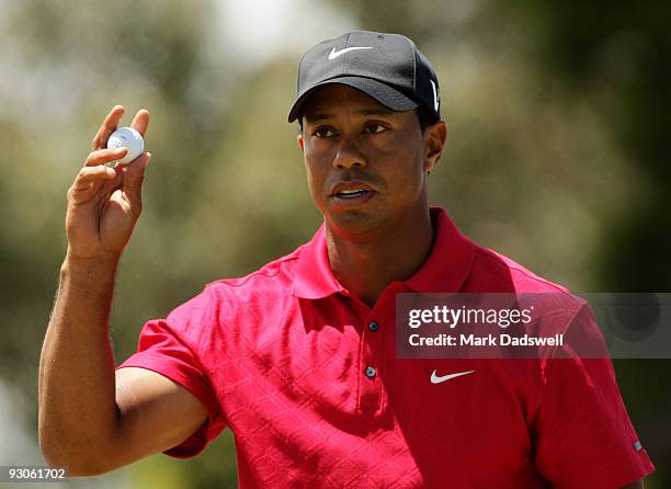 Tiger Woods of the USA acknowledges the crowd on the 5th hole during the final round of the 2009 Australian Masters at Kingston Heath Golf Club on...