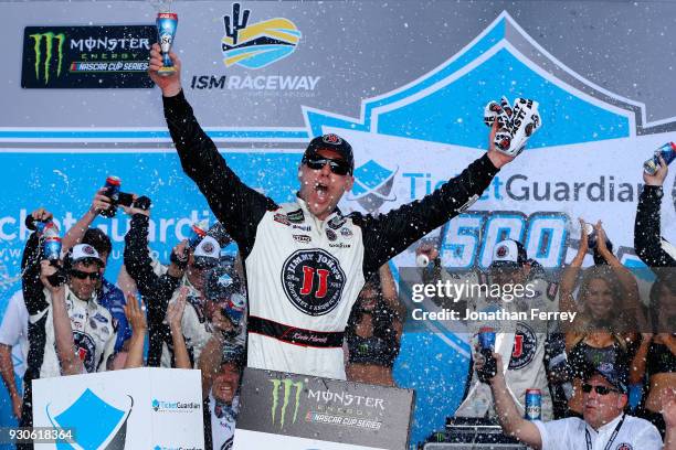 Kevin Harvick, driver of the Jimmy John's Ford, celebrates in Victory Lane after winning the Monster Energy NASCAR Cup Series TicketGuardian 500 at...