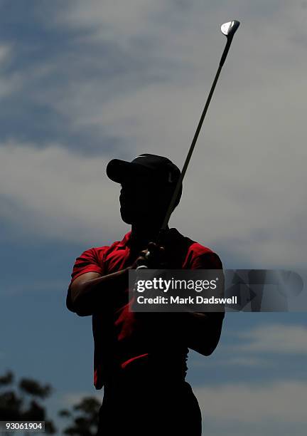 Tiger Woods of the USA plays an approach shot on the 6th hole during the final round of the 2009 Australian Masters at Kingston Heath Golf Club on...