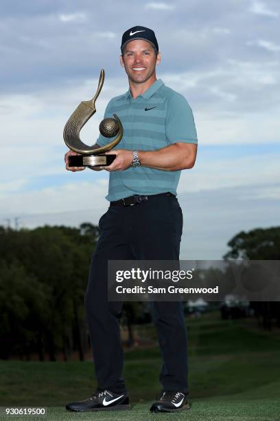 Paul Casey of England poses with the Valspar Championship trophy after winning at Innisbrook Resort Copperhead Course on March 11, 2018 in Palm...