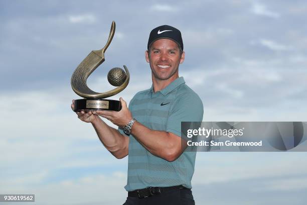 Paul Casey of England poses with the Valspar Championship trophy after winning at Innisbrook Resort Copperhead Course on March 11, 2018 in Palm...