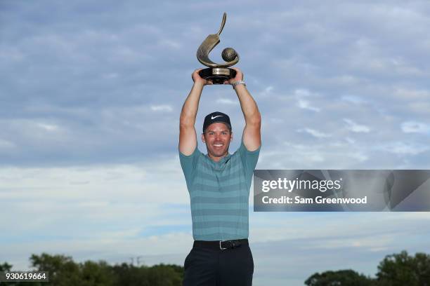 Paul Casey of England poses with the Valspar Championship trophy after winning at Innisbrook Resort Copperhead Course on March 11, 2018 in Palm...