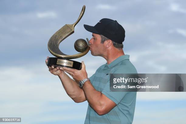 Paul Casey of England poses with the Valspar Championship trophy after winning at Innisbrook Resort Copperhead Course on March 11, 2018 in Palm...