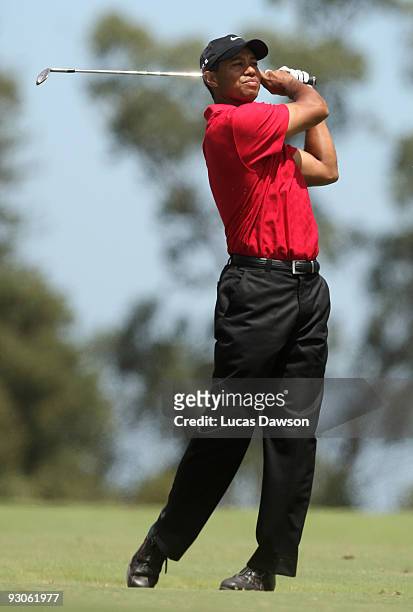 Tiger Woods of the USA plays an approach shot on the 3rd hole during the final round of the 2009 Australian Masters at Kingston Heath Golf Club on...