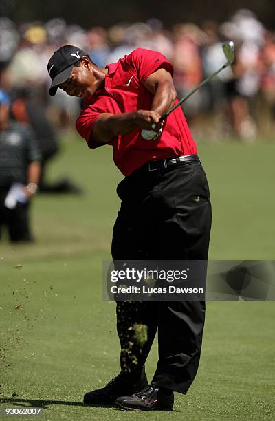 Tiger Woods of the USA plays an approach shot on the 7th hole during the final round of the 2009 Australian Masters at Kingston Heath Golf Club on...