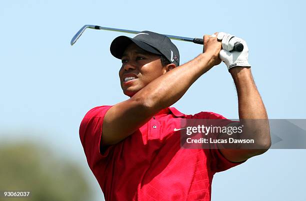 Tiger Woods of the USA plays an approach shot on the 4th hole during the final round of the 2009 Australian Masters at Kingston Heath Golf Club on...