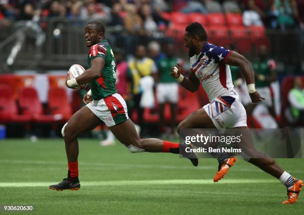 Willy Ambaka of Kenya scores a try against Matai Leuta of the United States away during the Canada Sevens, the Sixth round of the HSBC Sevens World...