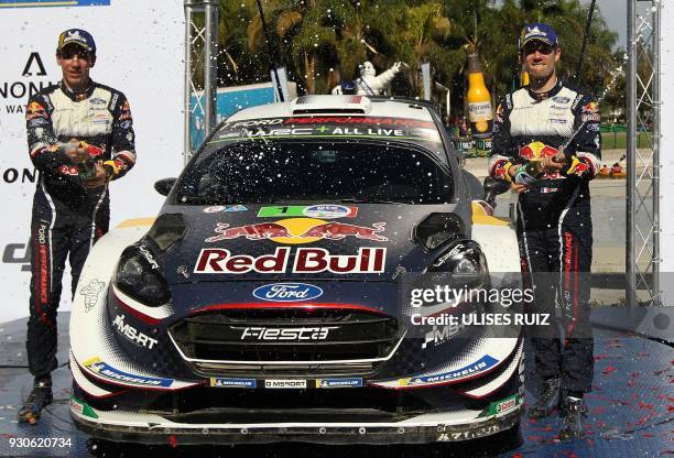 French Sebastian Ogier and co-driver Julien Ingrassia celebrate their victory after winning the 2018 FIA World Rally Champions in Leon, Guanajuato...