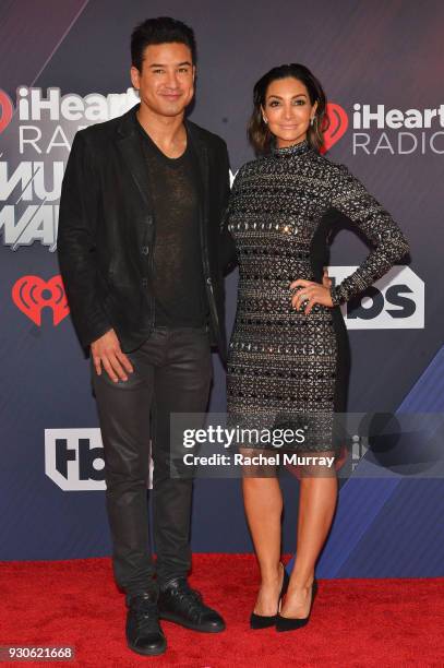 Mario Lopez and Courtney Laine Mazza arrive at the 2018 iHeartRadio Music Awards which broadcasted live on TBS, TNT, and truTV at The Forum on March...