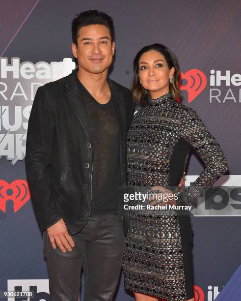 Mario Lopez and Courtney Laine Mazza arrive at the 2018 iHeartRadio Music Awards which broadcasted live on TBS, TNT, and truTV at The Forum on March...