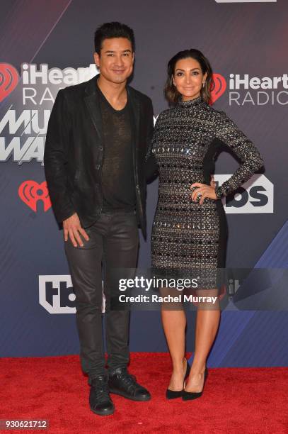 Mario Lopez and Courtney Laine Mazza arrive at the 2018 iHeartRadio Music Awards which broadcasted live on TBS, TNT, and truTV at The Forum on March...