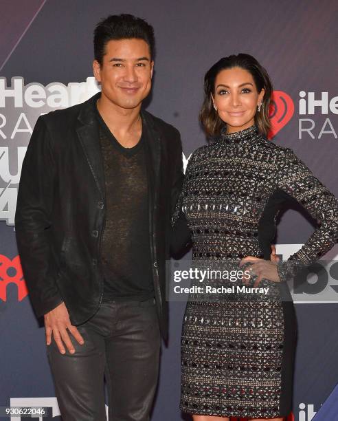 Mario Lopez and Courtney Laine Mazza arrive at the 2018 iHeartRadio Music Awards which broadcasted live on TBS, TNT, and truTV at The Forum on March...