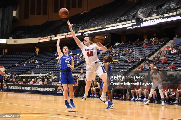 Kadri-Ann Lass of the Duquesne Lady Dukes takes a shot during the quarterfinal round of the Atlantic-10 Women's Basketball Tournament against the...