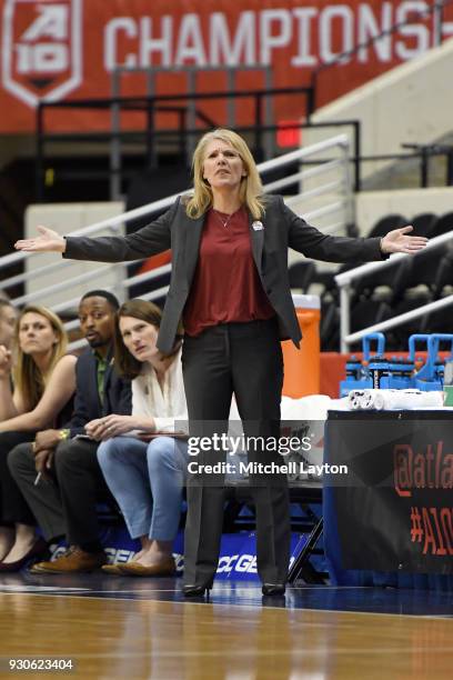 Head coach Cindy Griffin of the St. Joseph Hawks rects to a call during the quarterfinal round of the Atlantic-10 Women's Basketball Tournament...