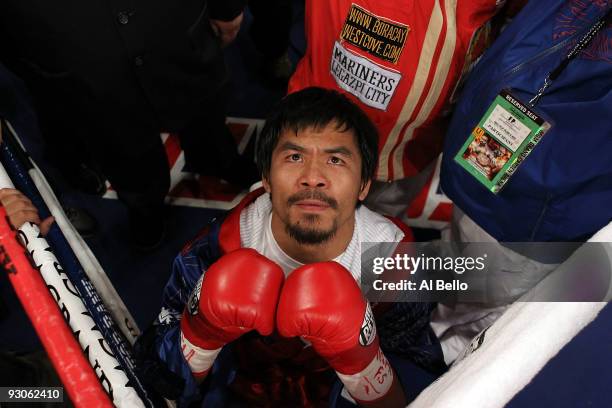 Manny Pacquiao prays in the ring before taking on Miguel Cotto during their WBO welterweight title fight at the MGM Grand Garden Arena on November...