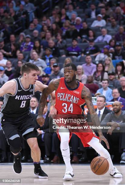 DeAndre Liggins of the New Orleans Pelicans drives on Bogdan Bogdanovic of the Sacramento Kings during an NBA basketball game at Golden 1 Center on...