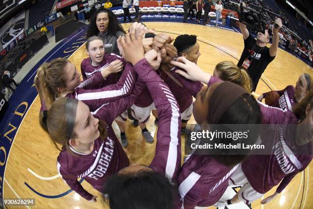 The Fordham Lady Rams huddle before the quarterfinal round of the Atlantic-10 Women's Basketball Tournament against the St. Joseph Rams at Richmond...