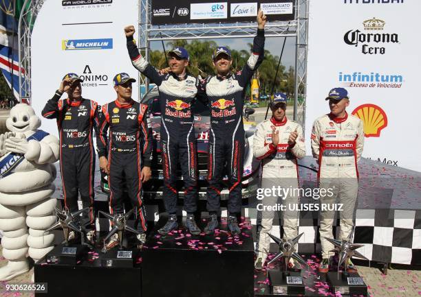 Spanish Carlos Del Barrio and Dani Sordo, French Julien Ingrassia and Sebastian Ogier, and British Irish Paul Nagle and Kris Meeke celebrate their...