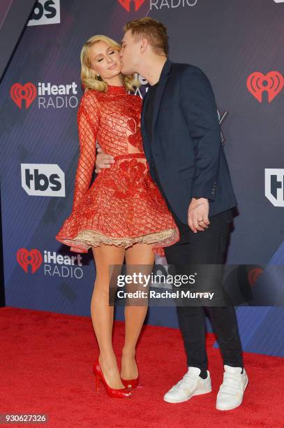 Paris Hilton and Chris Zylka arrive at the 2018 iHeartRadio Music Awards which broadcasted live on TBS, TNT, and truTV at The Forum on March 11, 2018...