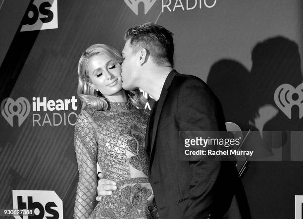 Paris Hilton and Chris Zylka arrive at the 2018 iHeartRadio Music Awards which broadcasted live on TBS, TNT, and truTV at The Forum on March 11, 2018...