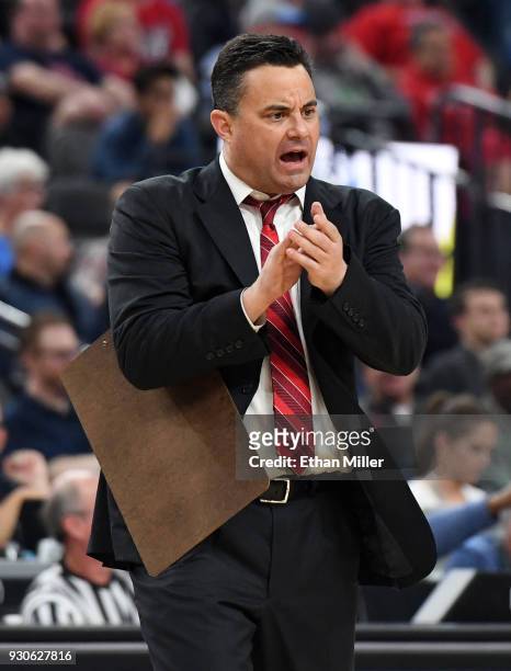 Head coach Sean Miller of the Arizona Wildcats claps during a timeout in the championship game of the Pac-12 basketball tournament against the USC...