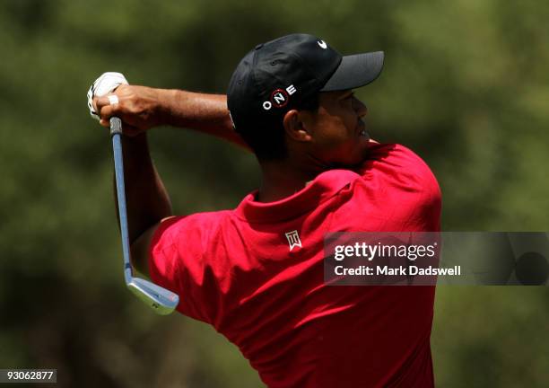 Tiger Woods of the USA plays an approach shot on the 5th hole during the final round of the 2009 Australian Masters at Kingston Heath Golf Club on...